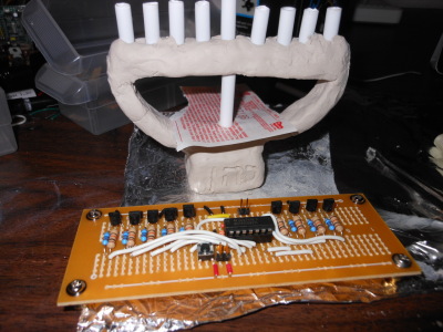 Clay menorah with circuit board