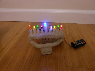 Clay menorah lit up