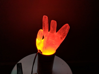 WS2812 LED buried in an ice hand glowing red.