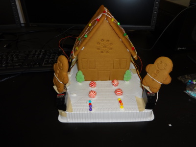 Gingerbread house with LEDs and servo motors
